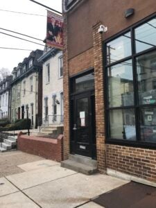 Brick building with black door