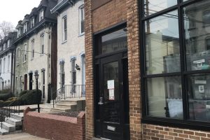 Brick building with black door